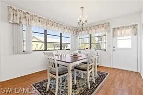 Living room featuring light wood-style flooring and ceiling fan