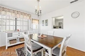 Bedroom with a ceiling fan and light colored carpet