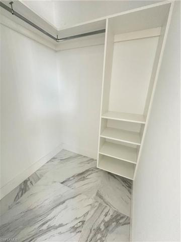 Walk-in closet. 2 of 2 in Owner's Suite