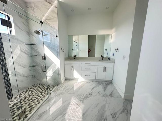 Owner’s Bathroom with double shower and sinks
