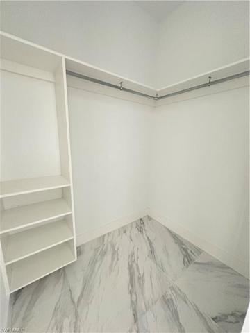 Walk-in closet. 2 of 2 in Owner's Suite