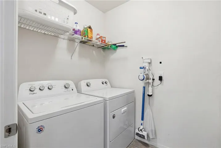 Laundry room featuring separate washer and dryer
