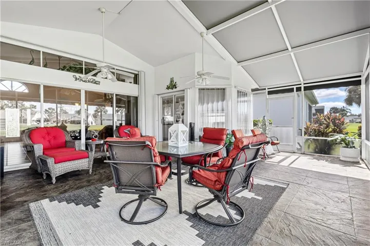 Sunroom featuring lofted ceiling