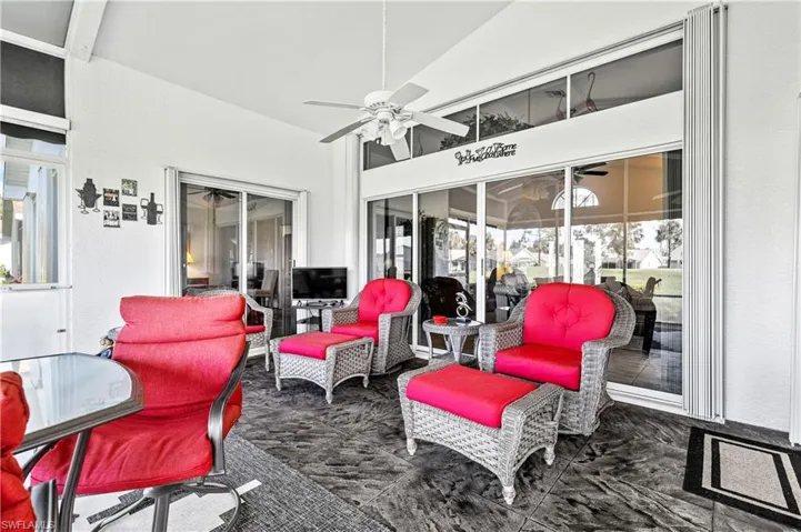 Sunroom with a patio and a ceiling fan