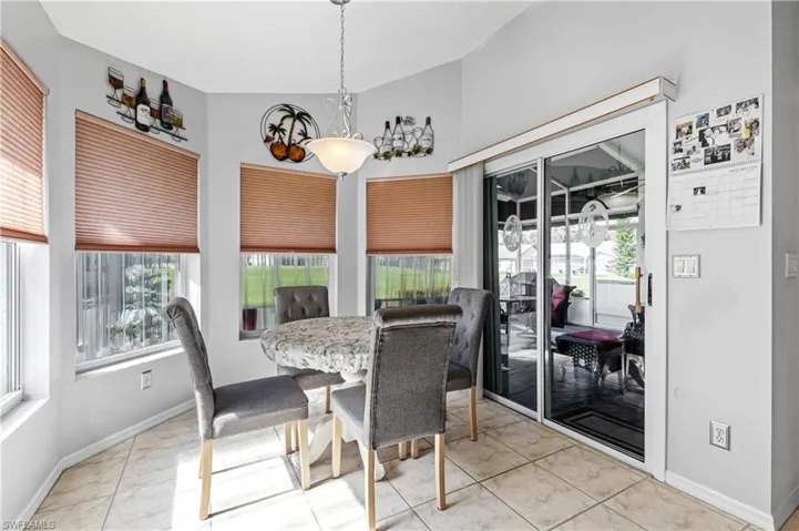 Dining room featuring baseboards and light tile patterned flooring