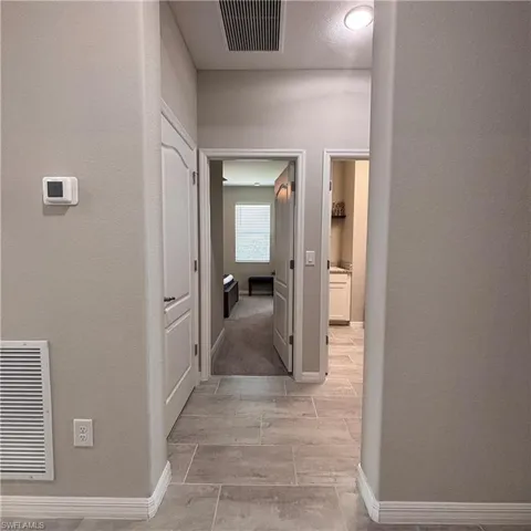 Hall featuring baseboards