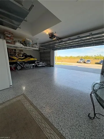 Garage with freestanding refrigerator