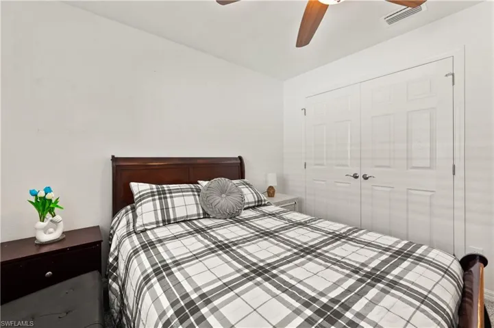 Bedroom featuring a closet and ceiling fan