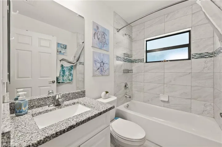 Full bath with shower / bathtub combination and vanity