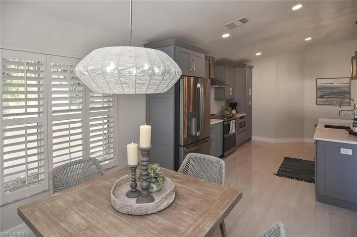 Dining room featuring recessed lighting Staged
