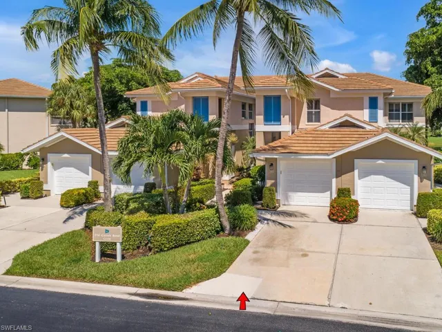 View of front of house featuring stucco siding, a garage, a tiled roof, and concrete driveway