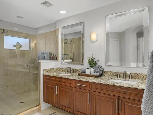 Master Bathroom with Porcelain flooring, double vanity, recessed lighting