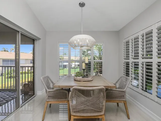 Dining space featuring a chandelier Staged