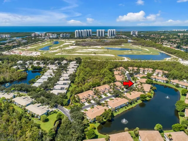 Bird's eye view of a nearby body of water and a golf club