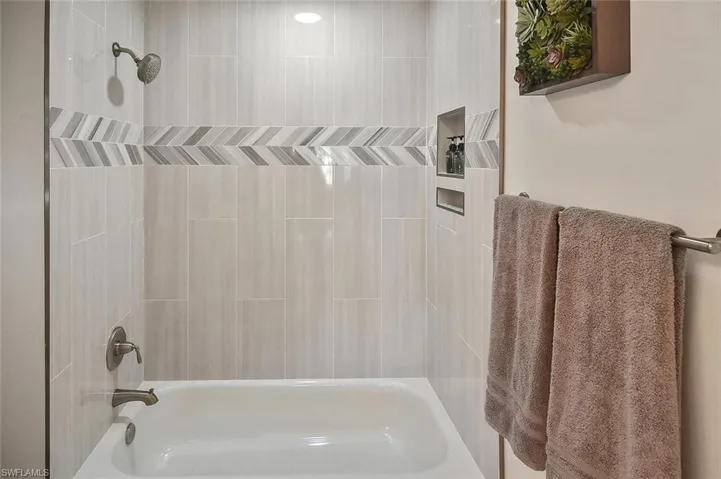 Guest Bathroom featuring shower / bath combination