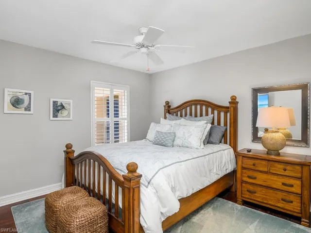 Bedroom featuring hardwood floors and ceiling fan