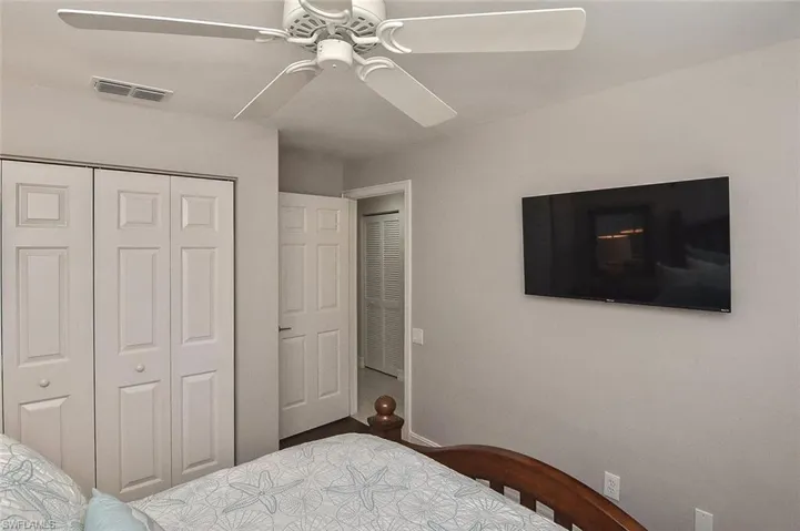 Bedroom featuring ceiling fan, a closet