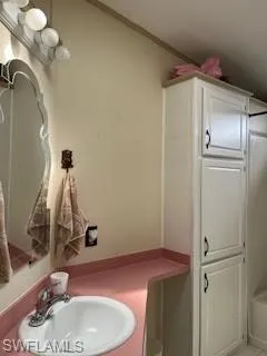 Full bath featuring vanity and shower / bath combination