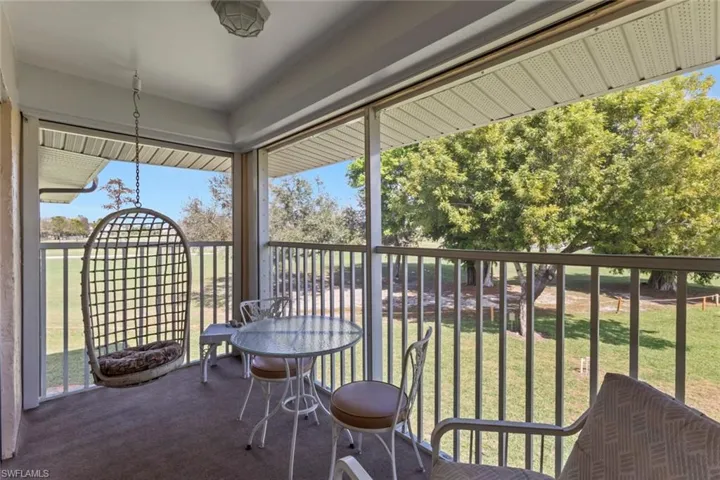 Sunroom / solarium with a balcony