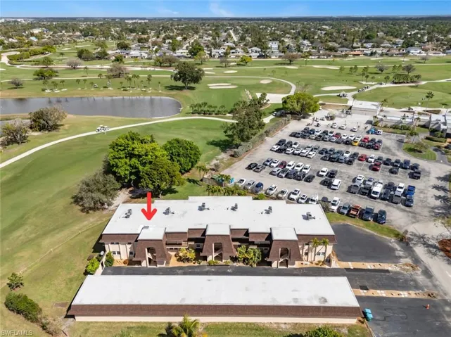 Drone / aerial view of a golf course and a large body of water