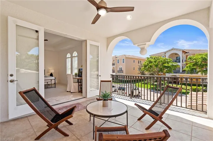 View of patio / terrace with a balcony and a ceiling fan