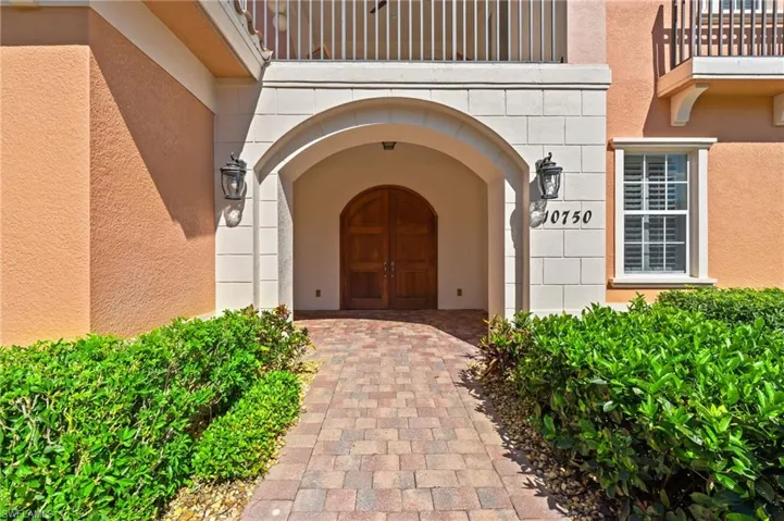 View of exterior entry with stucco siding