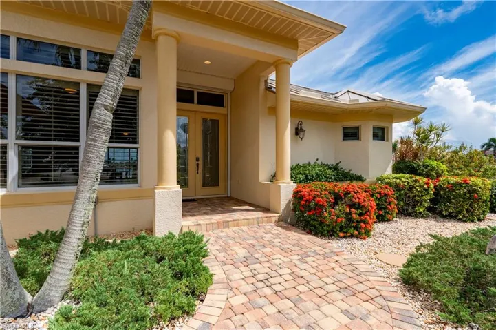View of exterior entry with covered porch