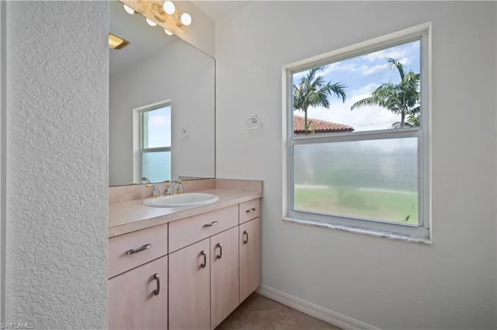 Bathroom with plenty of natural light and vanity