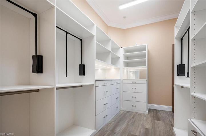 Primary suite closets with custom built-ins