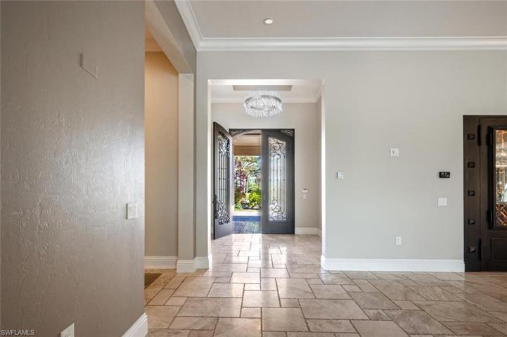 Double door entry into a welcoming foyer