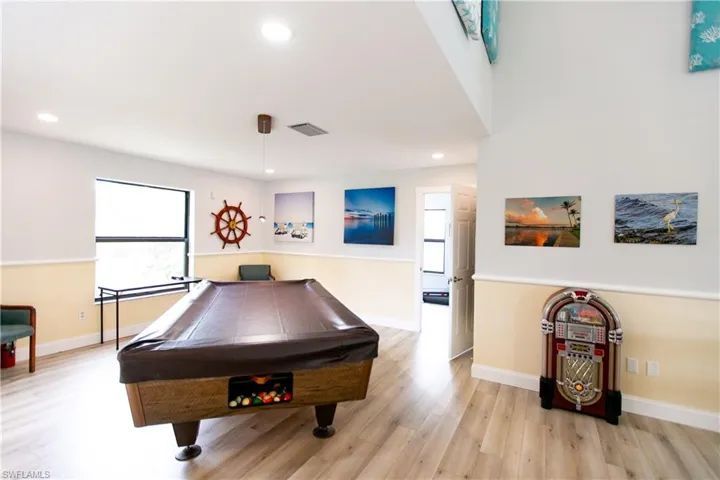 Playroom featuring billiards table, light wood-style floors, and recessed lighting