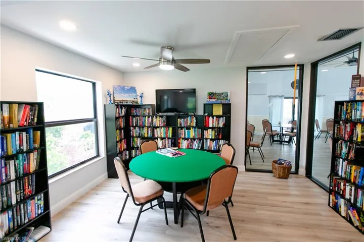 Playroom featuring a ceiling fan, light wood-type flooring, attic access, and recessed lighting