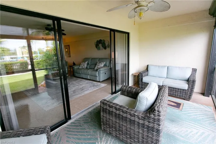 Sunroom featuring ceiling fan and an outdoor hangout area