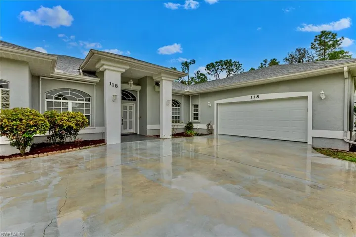 View of front of property featuring a garage
