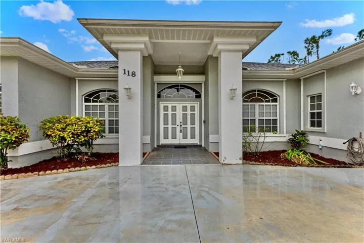 Doorway to property featuring french doors