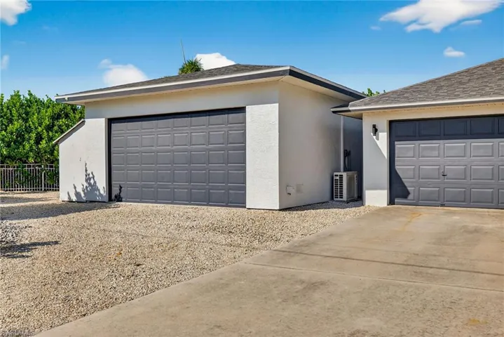 Garage with concrete driveway