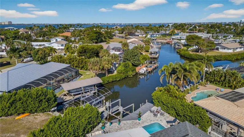 Aerial perspective of suburban area with a nearby body of water