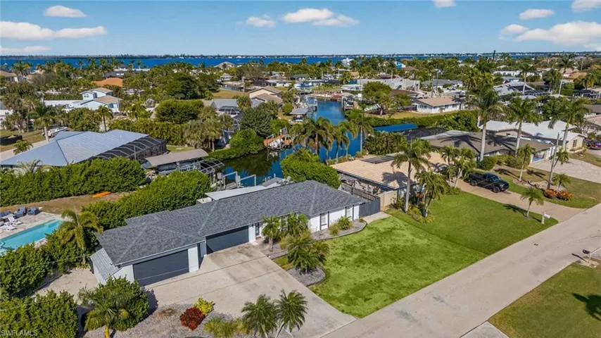 Aerial perspective of suburban area with a large body of water