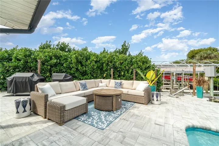 View of patio featuring area for grilling and an outdoor pool