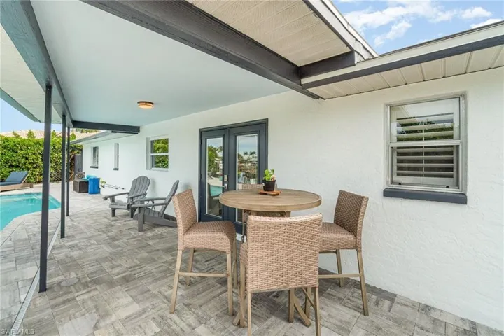 View of patio / terrace featuring an outdoor pool and outdoor dining space