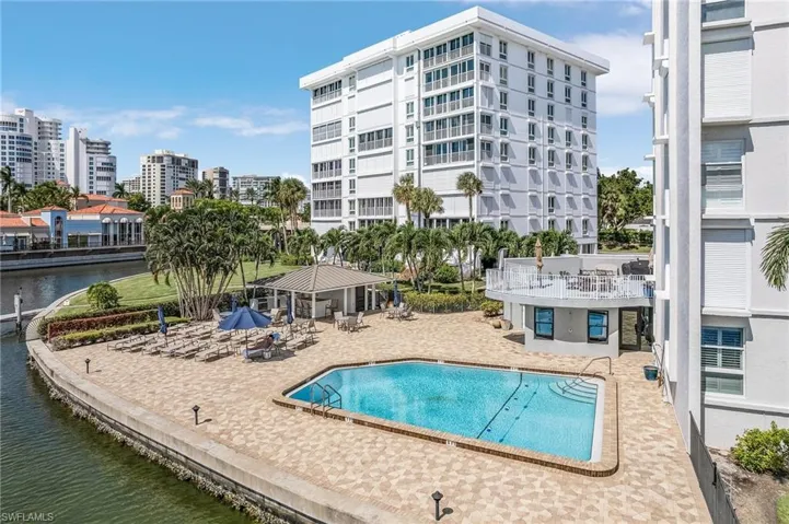 View of swimming pool featuring a gazebo, a patio, and a water view