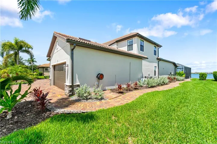 View of property exterior featuring a yard