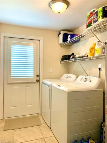 Laundry room with washing machine and clothes dryer