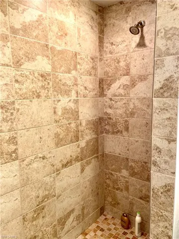 Master bath tile shower with 2 shower heads.