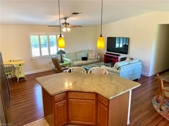 Kitchen open to great room activities.