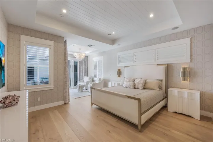 Primary Suite with seating area open to outdoor living