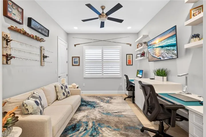 Dual workspace present here in custom built-ins. Space for sofa bed in this 3rd bedroom used currently as a den.