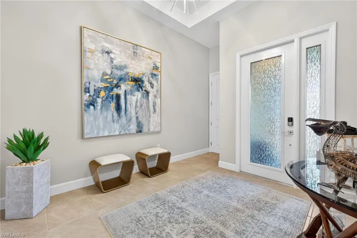 The Sierra has a grand, welcoming foyer! Window tint on front door and side window provide privacy in this all tile home...