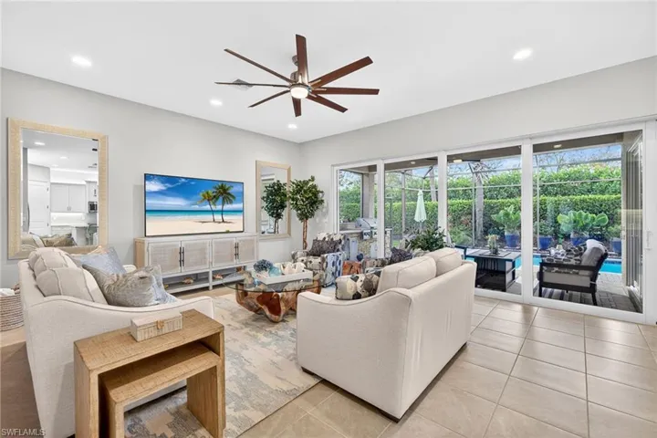 The great room is spacious , comfortably seats 7, features high hats and ceiling fan.