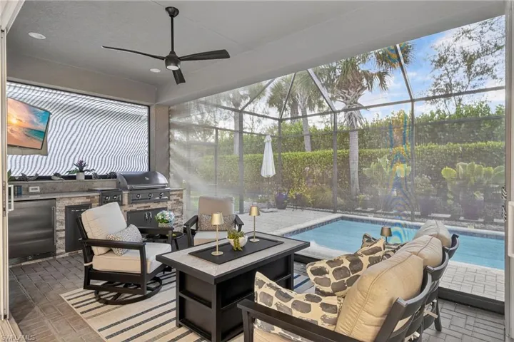 OK...So you have an outside tv to watch sports on a lazy Sunday, an amazing outdoor kitchen to prepare dinner and a pool and lush landscaping to feast your eyes on! What more could you ask for?